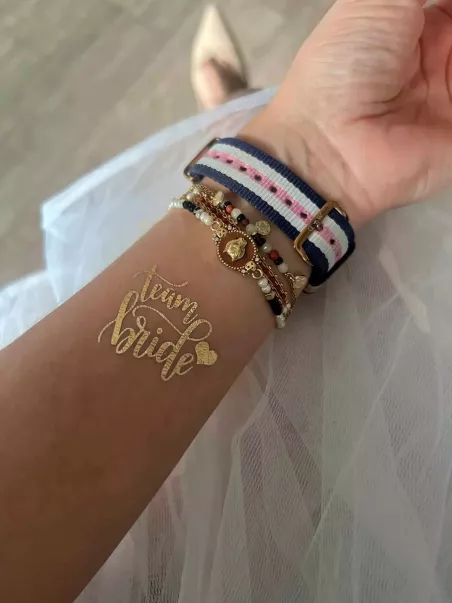 Gold team bride tattoo